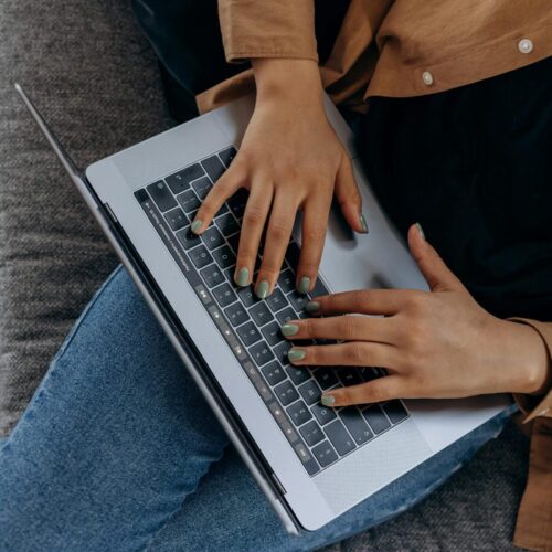 Typing on laptop