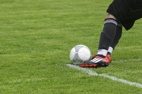 Player kicking soccer ball